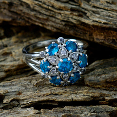 Nisa blue gemstone statement ring with multiple blue stones set in intricate silver band design