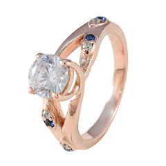 Isabel rose gold ring with large clear center stone and blue gemstone statement ring accents