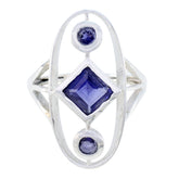 Siti blue gemstone trilogy ring with silver setting featuring three deep blue stones in unique design