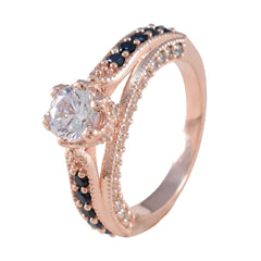 Julia blue halo gemstone ring with rose gold band and sparkling blue and clear stones