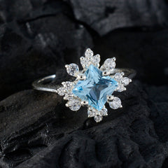 Riya Blue Halo Ring with Sparkling Gemstones