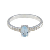 Eun-ji blue halo ring for women featuring an oval blue gemstone and diamond-accented silver band