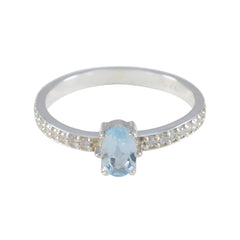 Eun-ji blue halo ring for women featuring an oval blue gemstone and diamond-accented silver band