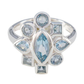 Lucy blue navratna ring with multiple blue gemstones set in silver band