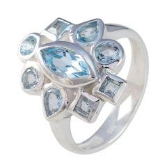 Lucy blue navratna ring with multiple light blue gemstones set in silver band