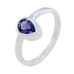 Mei blue solitaire gemstone ring with pear-shaped blue stone set in silver band