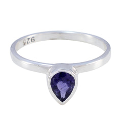 Mei blue solitaire gemstone ring with teardrop shaped blue stone set in sterling silver band