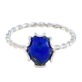 Riya blue solitaire twist ring with a deep blue oval stone and twisted silver band