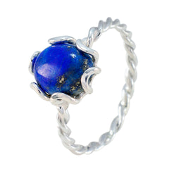 Riya blue solitaire twist ring with a deep blue gemstone and twisted silver band design