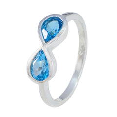 Siti silver boho blue gemstone ring featuring two pear-shaped blue stones in an infinity design