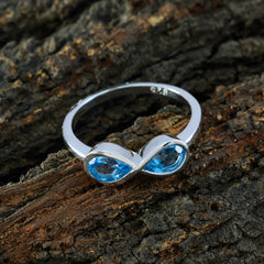 Siti boho blue gemstone ring with two blue gemstones set in a silver infinity design