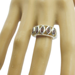 Ayesha boho red gemstone ring sterling silver band with five marquise red stones on a mannequin hand