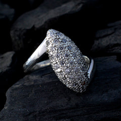 Audrey boho white halo ring with marquise pave crystal cluster in sterling silver photographed on dark stone
