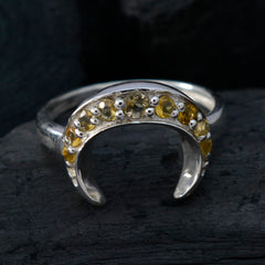 Nari boho yellow gemstone ring with crescent shape and multiple yellow stones set in silver band