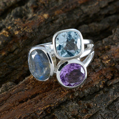 Bianca silver three stone ring with blue topaz amethyst and labradorite on bark colorful statement jewelry ring