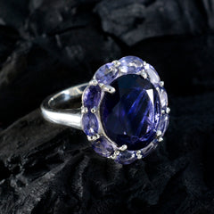 Lucia contemporary blue gemstone ring with a large central blue stone surrounded by smaller purple gemstones