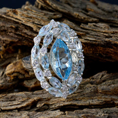 Tereza contemporary blue gemstone ring with marquise cut stones set in silver on rustic wood