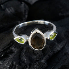 Katarina contemporary multicolor gemstone ring with pear-shaped main stone and two green side stones