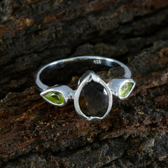 Katarina contemporary multicolor gemstone ring with pear-shaped center stone and green side stones