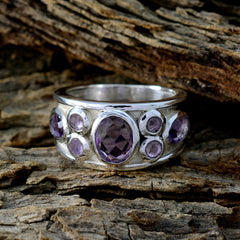 Meera sterling silver wide band contemporary purple gemstone ring with faceted oval center and six accent stones