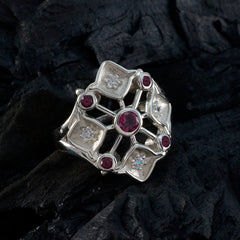 Emily contemporary red gemstone ring with silver intricate design and multiple red and clear stones