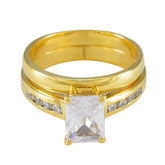 Ayesha gold band ring with emerald cut center stone and channel set accents contemporary white stone ring