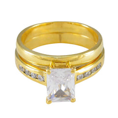 Ayesha gold band ring with emerald cut center stone and channel set accents contemporary white stone ring