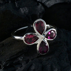 Ayesha floral gemstone ring for women with four deep red teardrop gemstones on silver band