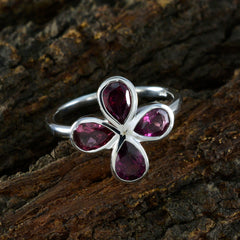 Ayesha floral gemstone ring for women featuring four deep purple teardrop gemstones in a flower design on a silver band