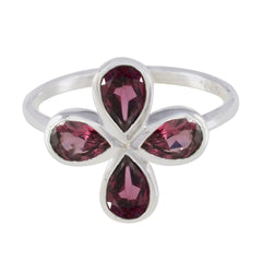 Ayesha floral gemstone ring for women featuring four deep pink teardrop gemstones on silver band