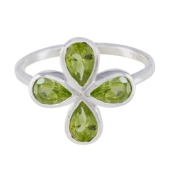 Liyana silver ring with four pear shaped peridot stones arranged as a floral clover green gemstone floral ring