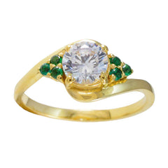 Araya gold ring with central round white stone and emerald side stones green gemstone romantic ring