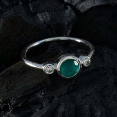 Rina elegant green trilogy ring with a central green gem and two clear side stones on silver band