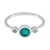 Rina silver green trilogy ring with a central green gemstone and two clear side stones