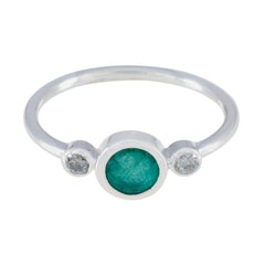 Rina silver green trilogy ring with a central green gemstone and two clear side stones
