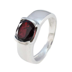 Saanvi luxurious red solitaire ring with deep oval faceted red gemstone set in polished silver band