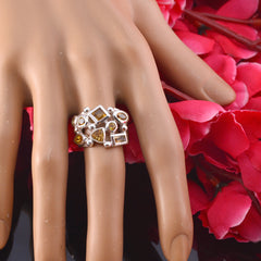 Gabriela modern yellow gemstone ring with mixed geometric stones on silver band on mannequin hand