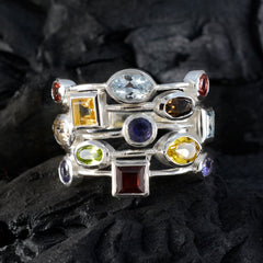 Hanna multicolor cocktail ring with assorted gemstones set in silver bands on black background