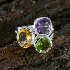 Camilla multicolor gemstone cocktail ring with purple, yellow, and green stones on silver band