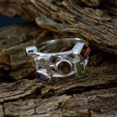Skylar multicolor gemstone cocktail ring with purple, green, and orange stones on silver band