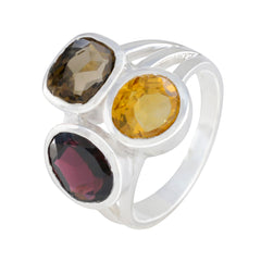Ava multicolor gemstone cocktail ring featuring three large faceted stones set on a silver band