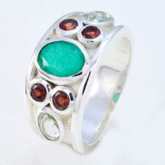 Natcha multicolor gemstone ring with green, red, and clear stones set in silver band
