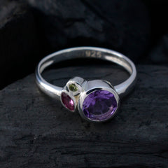 Min-seo multicolor gemstone trilogy ring with purple, red, and green stones set in silver