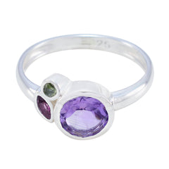 Min-seo multicolor gemstone trilogy ring with purple, green, and dark pink gemstones in silver band