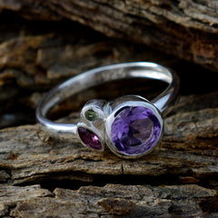 Min-seo multicolor gemstone trilogy ring with purple, green, and pink stones on silver band