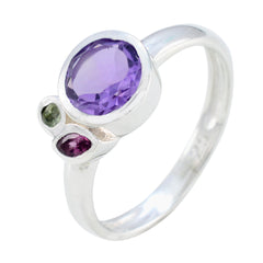 Min-seo multicolor gemstone trilogy ring with purple, green, and red gemstones set in silver band
