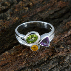 Julieta multicolor gemstone trilogy ring with green, purple, and yellow gemstones on silver band