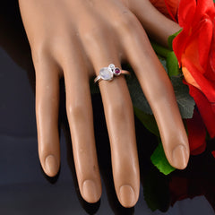 Ying multicolor trilogy gemstone ring on mannequin hand with silver band and moonstone white and pink gems