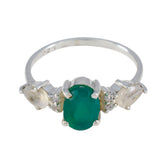 Laura multicolor trilogy ring for women featuring an oval green center stone with side clear gemstones