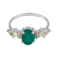 Laura multicolor trilogy ring for women featuring an oval green center stone with side clear gemstones